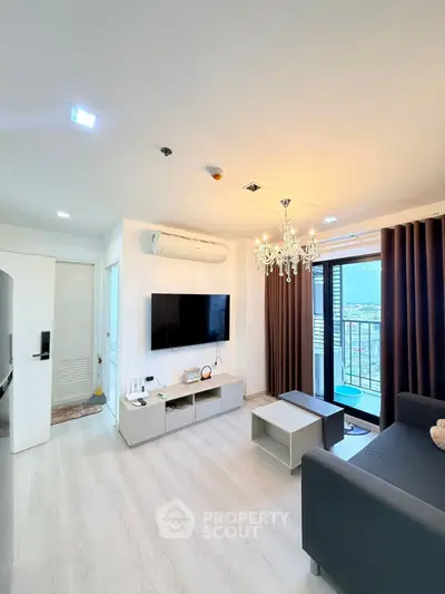 Modern living room with chandelier and balcony view in stylish apartment