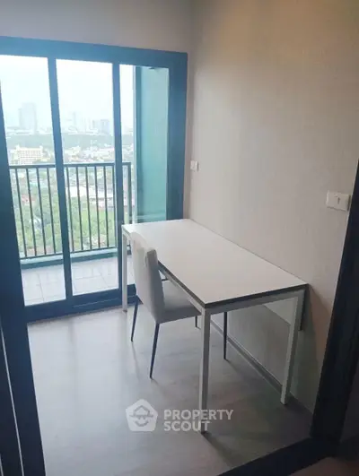 Modern study room with city view and balcony access