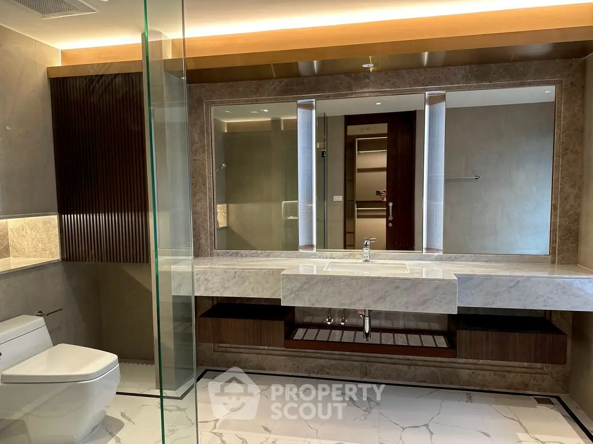 Luxurious modern bathroom with marble countertops and elegant lighting