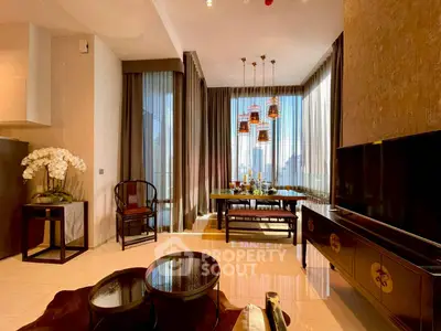 Luxurious living room with elegant decor and city view, featuring stylish furniture and ambient lighting.