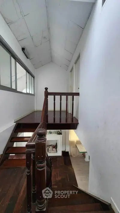 Charming staircase with wooden railing in a cozy home interior