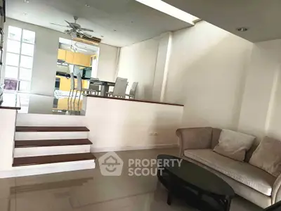Spacious living room with modern open layout and elegant dining area