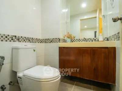 Modern bathroom with sleek design and stylish fixtures in a contemporary home.