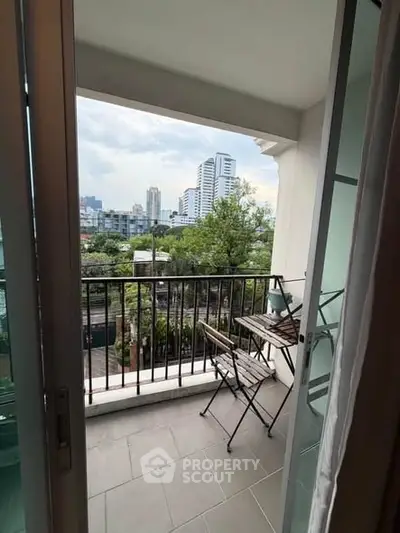 Charming balcony with city view, perfect for relaxation and enjoying the skyline.
