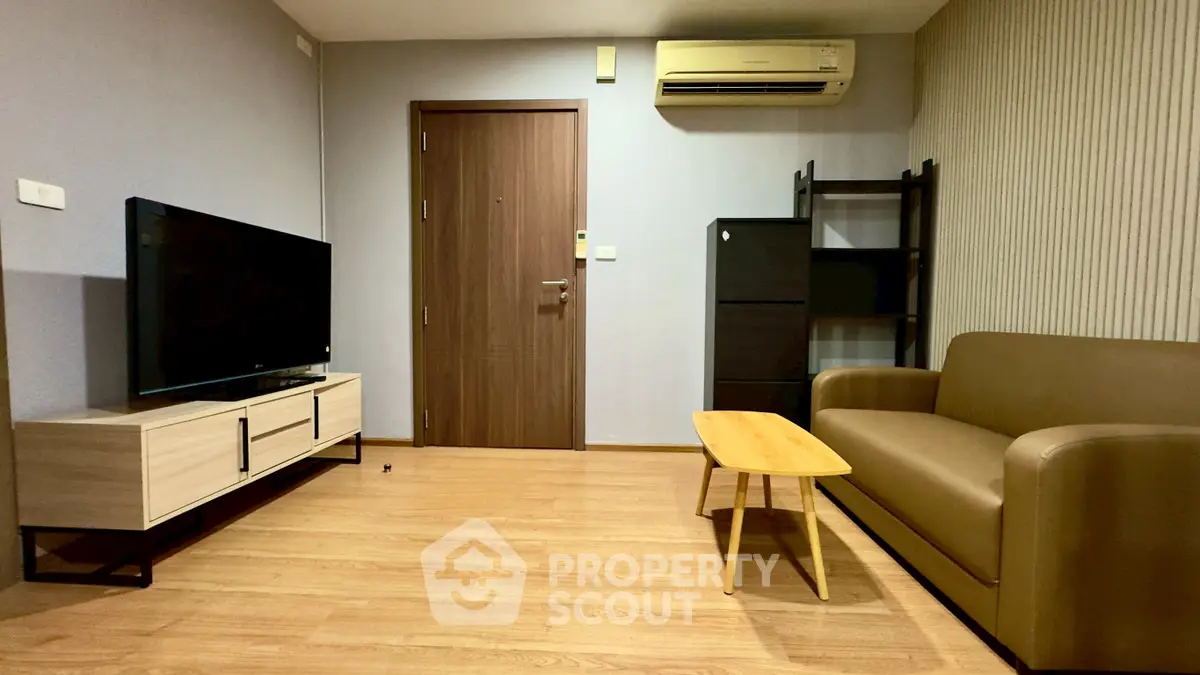 Modern living room with sleek furniture and wooden flooring