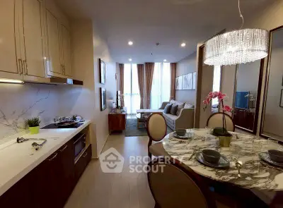 Luxurious open-plan kitchen and living room with elegant dining area and modern decor.