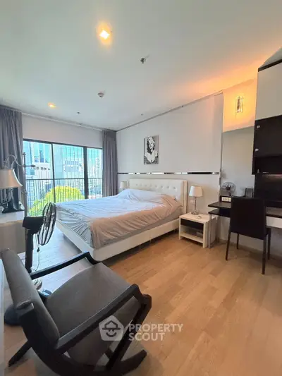 Modern bedroom with large windows and sleek design