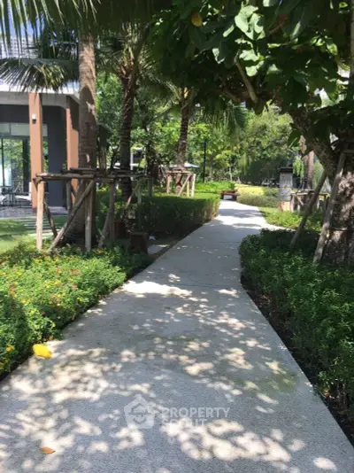 Lush garden pathway in modern residential complex