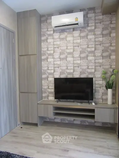 Modern living room with stylish TV unit and air conditioning