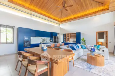 Luxurious open-plan living room with modern kitchen and elegant wooden ceiling
