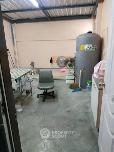 Spacious storage room with industrial vibe and essential utilities