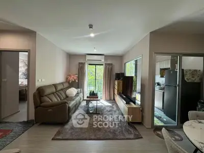 Spacious living room with modern decor and balcony view