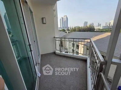 Spacious balcony with city view in modern urban apartment