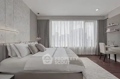 Luxurious modern bedroom with elegant decor and city view.