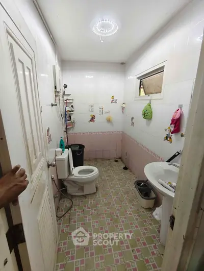 Charming bathroom with vintage tiles and modern fixtures, perfect for a cozy home.