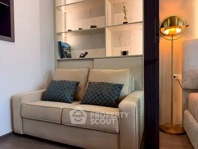 Cozy living room with stylish sofa and elegant shelving unit