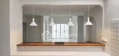 Modern kitchen with open layout and stylish pendant lights