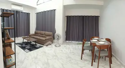 Spacious modern living room with elegant furniture and dining area, featuring marble flooring.