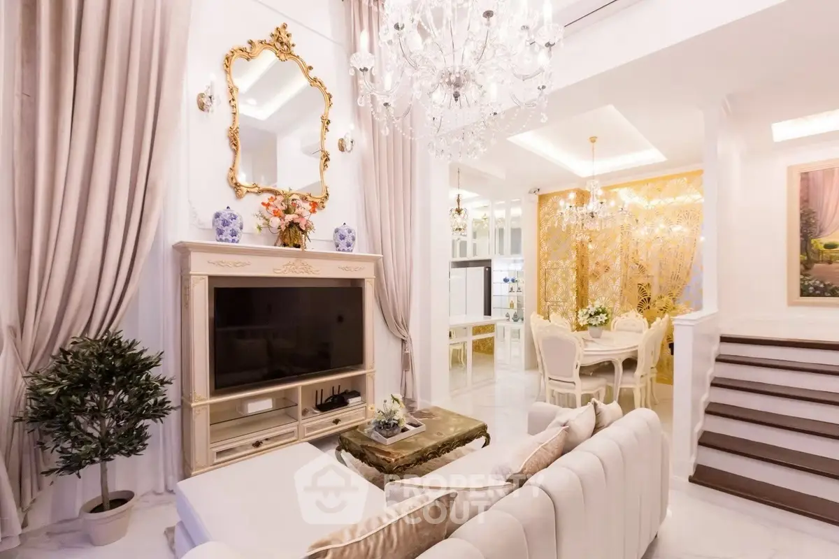 Luxurious living room with elegant chandelier and classic decor