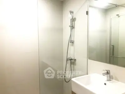 Modern bathroom with sleek shower and minimalist sink design