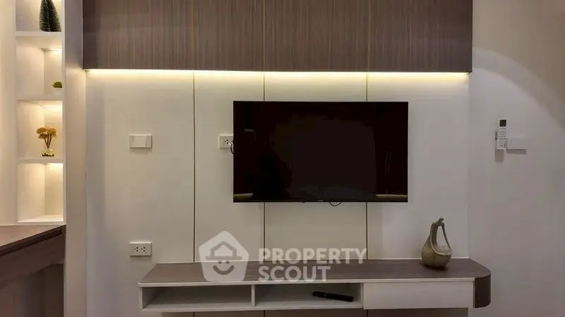 Modern living room with sleek TV unit and ambient lighting