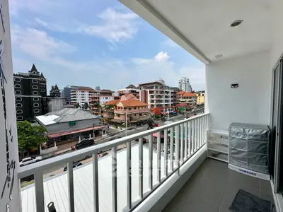 Spacious balcony with city view, perfect for relaxation and enjoying urban scenery.