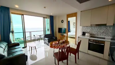 Stunning ocean view from modern open-plan living room and kitchen in luxury apartment