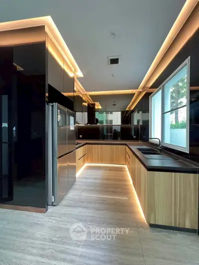 Modern kitchen with sleek cabinetry and ambient lighting