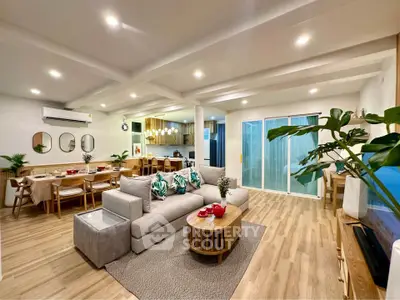 Spacious modern living room with open kitchen and elegant decor