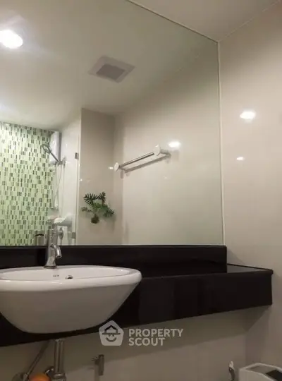 Modern bathroom with sleek sink and stylish tile accents