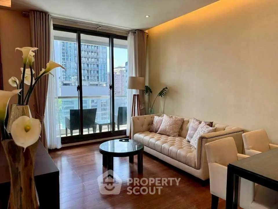 Elegant living room with modern decor and balcony view in urban apartment