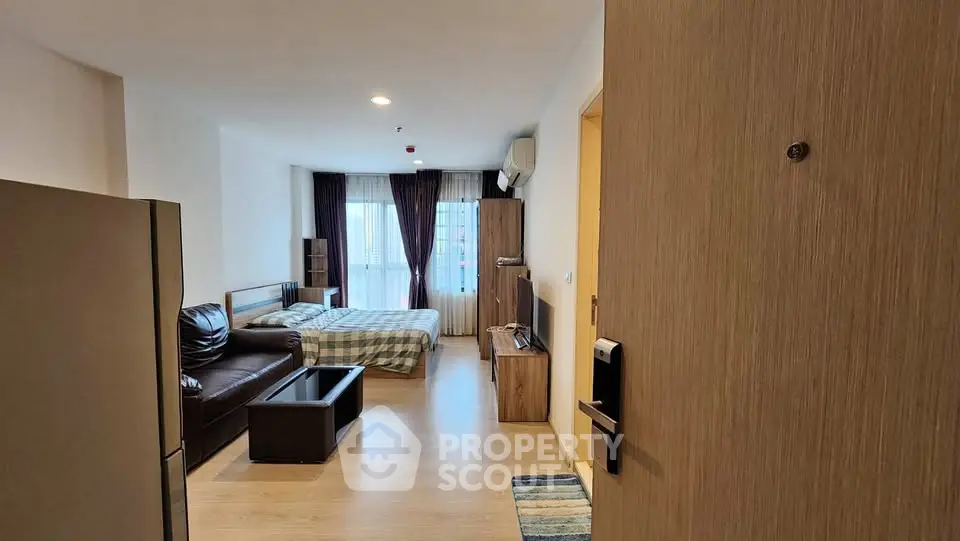 Spacious studio apartment with modern furnishings and natural light