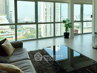 Spacious living room with stunning city view and modern decor
