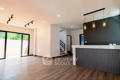 Spacious modern living room with open layout and stylish lighting