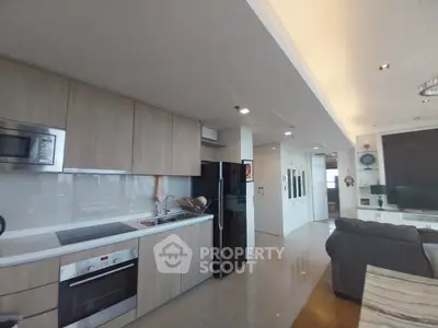 Modern open-layout kitchen with sleek appliances and spacious living area