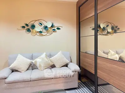 Stylish living room with modern decor and cozy sofa in elegant apartment.