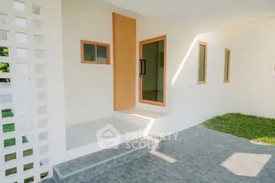 Modern minimalist home entrance with clean lines and natural light