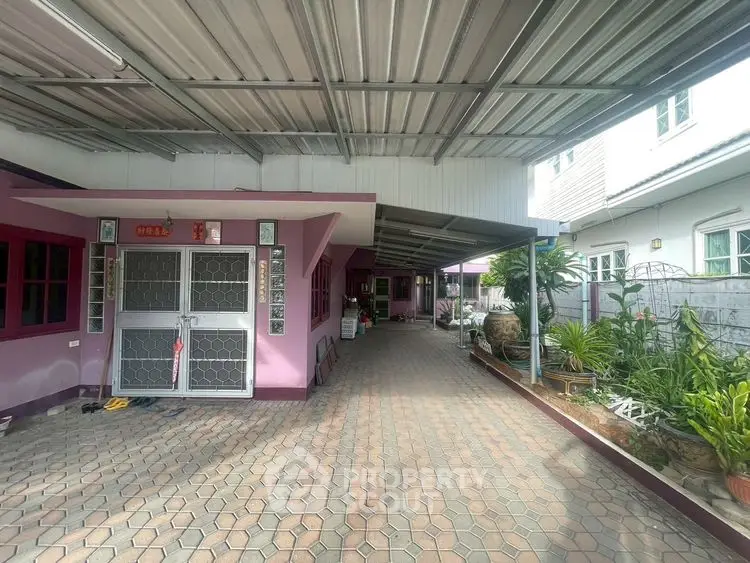 Spacious covered driveway with garden in suburban home