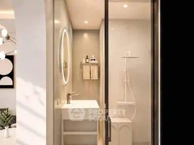 Modern bathroom with sleek shower and illuminated mirror in stylish apartment.