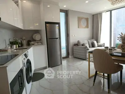 Modern open-plan kitchen and living room with sleek design and natural light.