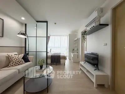 Modern open-plan living room with stylish decor and natural light