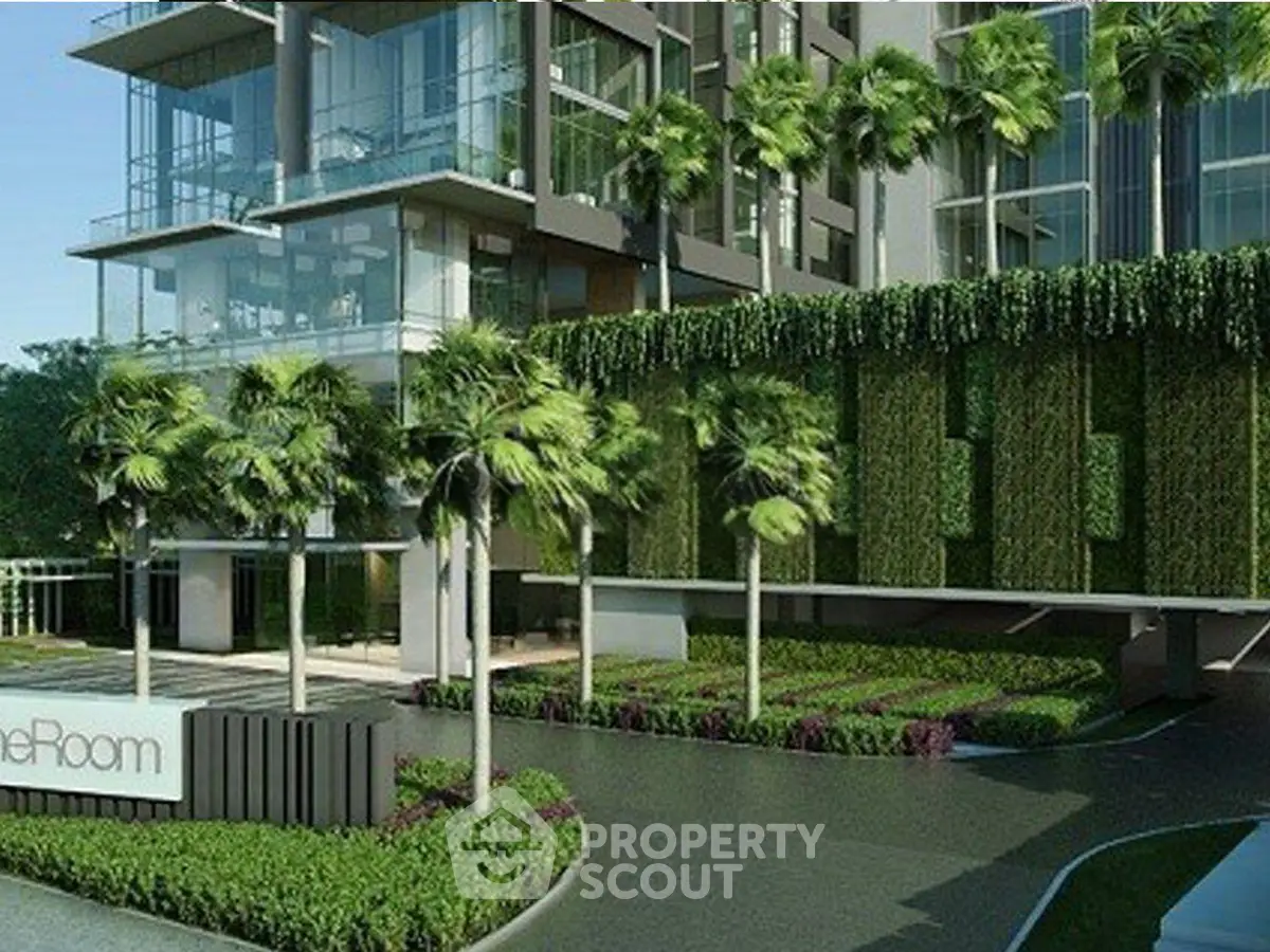 Luxurious modern building exterior with lush greenery and palm trees, showcasing contemporary architecture.