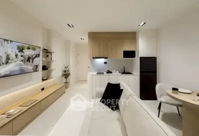 Modern open-plan living room with sleek kitchen and cozy seating area