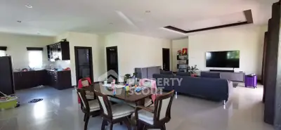 Spacious open-plan living and dining area with modern kitchen and stylish furnishings.