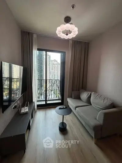 Modern living room with balcony view in high-rise apartment