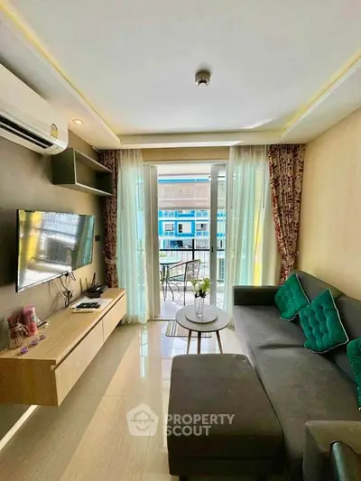 Modern living room with balcony view, featuring sleek furniture and stylish decor.