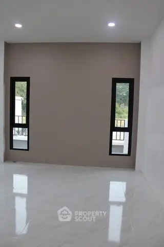 Spacious modern room with large windows and glossy floor tiles, perfect for customization.