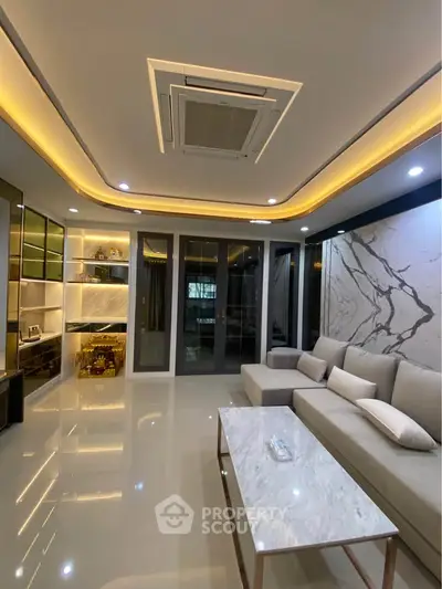 Luxurious modern living room with elegant lighting and marble accents