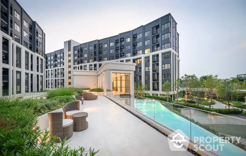 Modern apartment building with pool and garden view