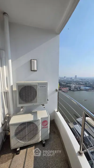 High-rise balcony with air conditioning units and stunning river view